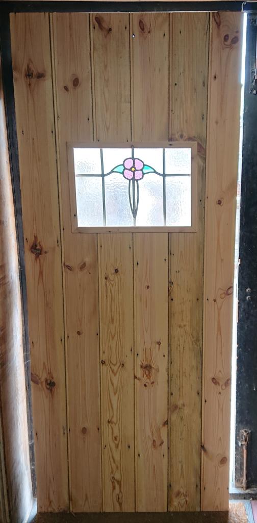 <p>Ledge and Brace Door with Stain Glass window</p><p>Made from Reclaimed Pine</p><p>32 1/2" x 78"</p>